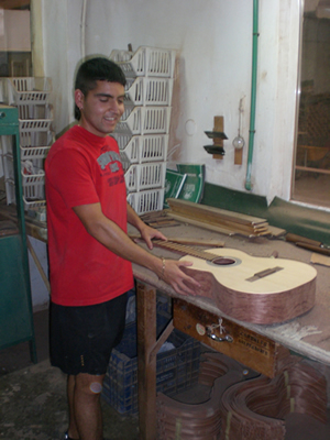 Danni - our charming guide showing us how the frets and bridge are measured and fixed