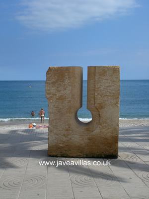 Javea Port sculptures are changed every year.  This one is made using the local tosca stone.